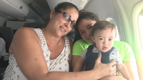 Lydia Acevedo, her year-old grandson Mateo and her daughter
Nayelys aboard the evacuation flight.