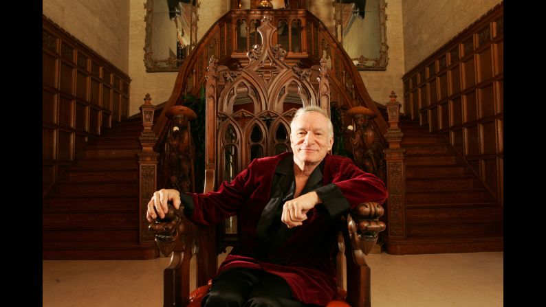Hefner built himself into an icon, along with the Playboy Mansion, in which he posed for this November 2005 photo. The building was <a href="index.php?page=&url=http%3A%2F%2Fmoney.cnn.com%2F2016%2F08%2F17%2Freal_estate%2Fplayboy-mansion-sale%2Findex.html">sold for $100 million in 2016</a>, but Hefner remained living there until his death. 