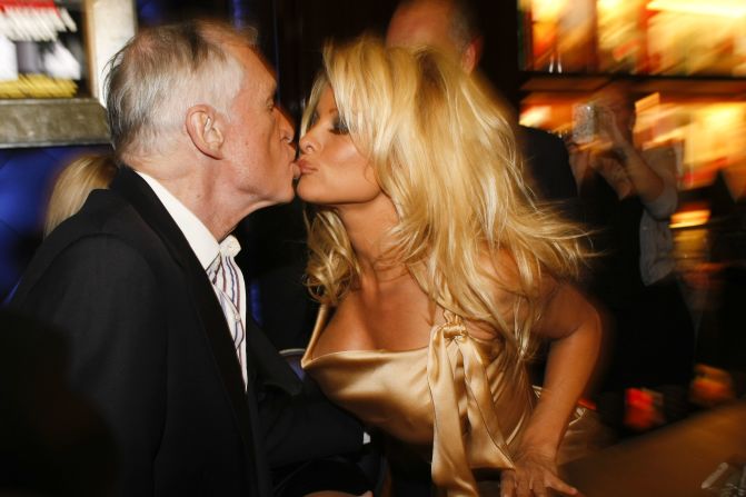 Hugh Hefner and Pamela Anderson attend a book signing session at Taschen on December 10, 2009 in Beverly Hills, California.