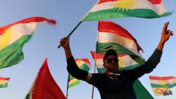 Syrian Kurds wave the Kurdish flag, in the northeastern Syrian city of Qamishli on September 27, 2017, during a gathering in support of the independence referendum in Iraq's autonomous northern Kurdish region.
Iraq's Kurds announced a massive "yes" vote for independence following a referendum that has incensed Baghdad and sparked international concern. / AFP PHOTO / DELIL SOULEIMAN        (Photo credit should read DELIL SOULEIMAN/AFP/Getty Images)