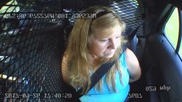 Shelia Warren sits in the back of a patrol car after being arrested in Washington County, Virginia.
