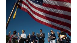 JERSEY CITY, NJ - SEPTEMBER 15: An American flag billows in the wind as immigrants stand and take the oath of allegiance to the United States during a naturalization ceremony at Liberty State Park, September 15, 2017 in Jersey City, New Jersey. To mark Citizenship Day, 35 immigrants became United States citizens during the ceremony. (Photo by Drew Angerer/Getty Images)