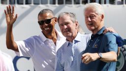 JERSEY CITY, NJ - SEPTEMBER 28:  (L-R) Former U.S. Presidents Barack Obama, George W. Bush and Bill Clinton attend the trophy presentation prior to Thursday foursome matches of the Presidents Cup at Liberty National Golf Club on September 28, 2017 in Jersey City, New Jersey.  (Photo by Rob Carr/Getty Images)