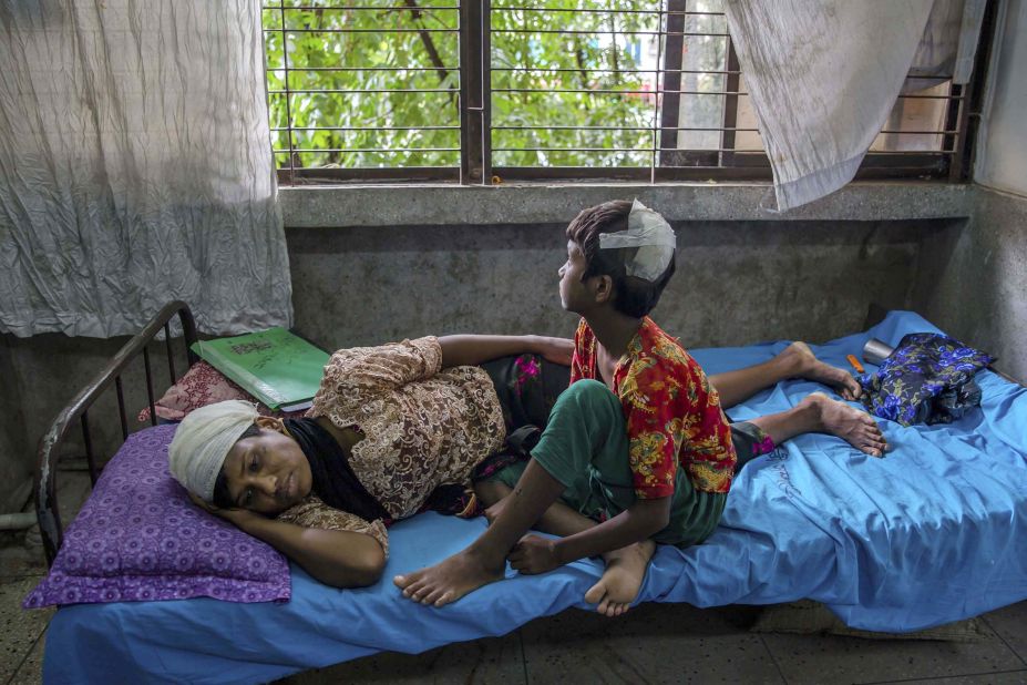 Dildar Begum, a Rohingya woman, and her daughter, Noor Kalima, recover from injuries at Sadar Hospital in Cox's Bazar after fleeing their home in Rakhine state.