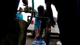 September 26, 2017. Puerto Rico. Utuado Puerto Rico. Employee of Aqueducts and Sewers Authority provide water to citizens of the remote village of Barrio Caguana, Utuado. After Hurricane Maria in Puerto Rico.