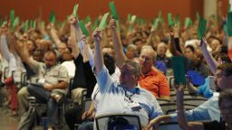 Members attending the Southern Baptist Convention vote to formally condemn the political movement known as the "alt-right," in a national meeting, Wednesday, June 14, 2017, in Phoenix. Southern Baptists on Wednesday formally condemned the political movement known as the "alt-right," in the meeting that was thrown into turmoil after leaders initially refused to take up the issue. (AP Photo/Ross D. Franklin)