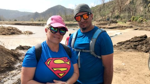 Maritza Rivera with her husband. They crossed the river to walk two hours to the nearest supermarket to buy bread and rice. 