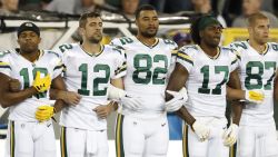 Green Bay Packers link arms during the national anthem before an NFL football game against the Chicago Bears Thursday, Sept. 28, 2017, in Green Bay, Wis. (AP Photo/Matt Ludtke)