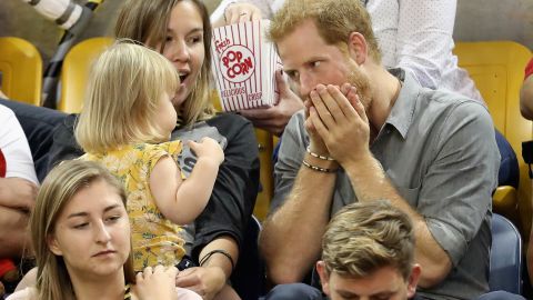 Prince Harry amuses Emily Henson, daughter of Hayley Henson, at the Sitting Volleyball Finals during the Invictus Games in September this year.