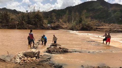 In San Lorenzo, a bridge destroyed by flash floods has been replaced for now by a cable.