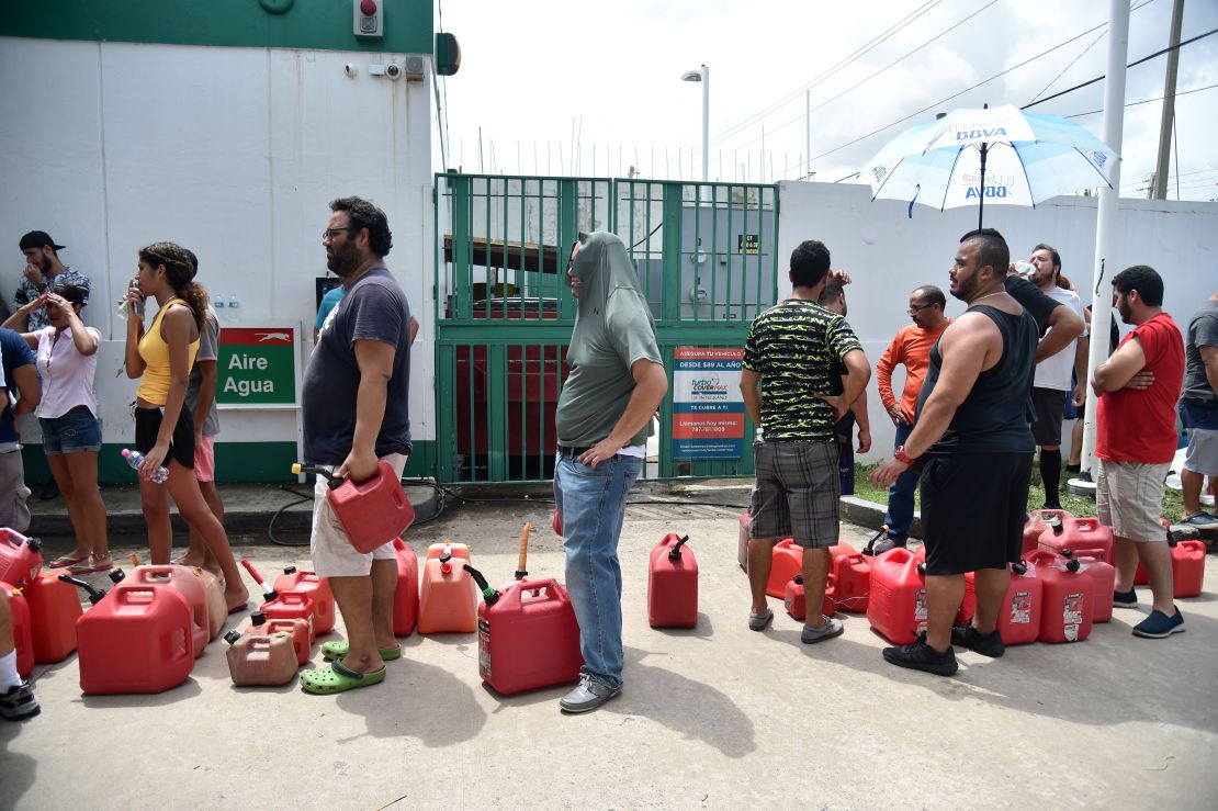 People waiting in line to buy gas are seen in Rio Hondo, Bayamon, Puerto Rico, on September 22, 2017.