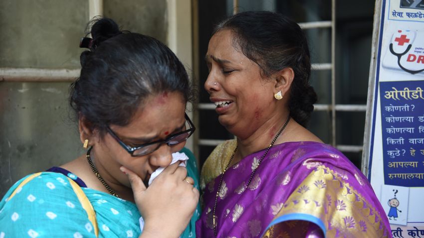 Indian relatives of victims injured at a stampede on a railway bridge react as they wait at a hospital in Mumbai on September 29, 2017.
Commuters stampeded on a Mumbai railway bridge during the morning rush hour September 29 killing at least 15 people, a disaster management official said. The cause of the stampede was not immediately known but Tanaji Pawar, a spokesman for Mumbai's disaster management cell, warned that the death toll "is likely to go up".
 / AFP PHOTO / PUNIT PARANJPE        (Photo credit should read PUNIT PARANJPE/AFP/Getty Images)