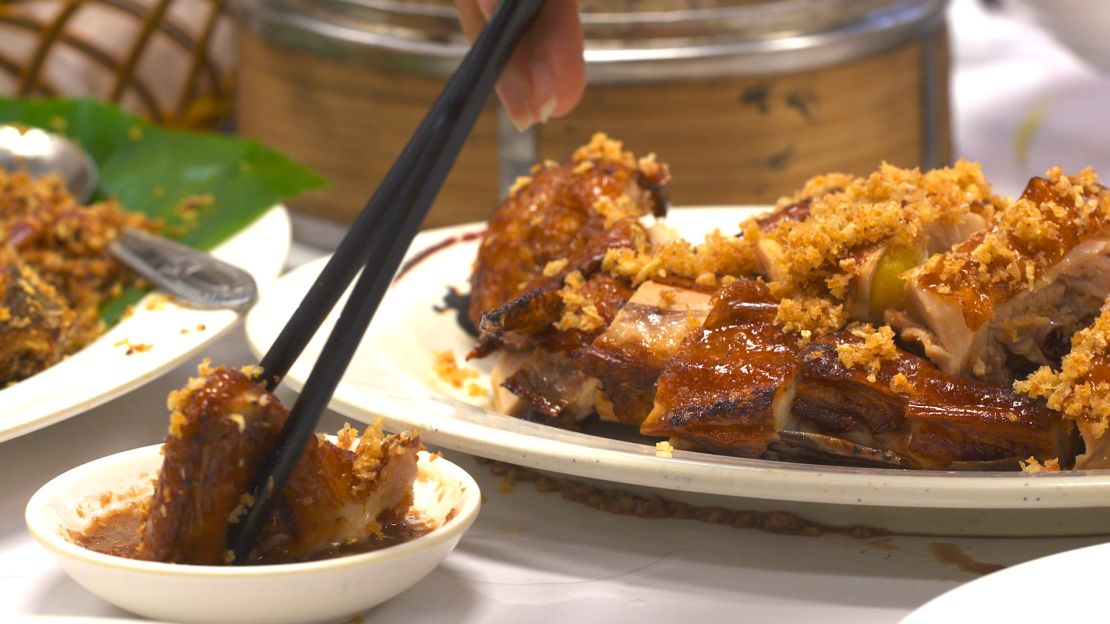 Wind Sand Chicken is marinated and deep-fried till its skin is crispy but the meat remains moist. It's served buried in fried garlic and other spices.