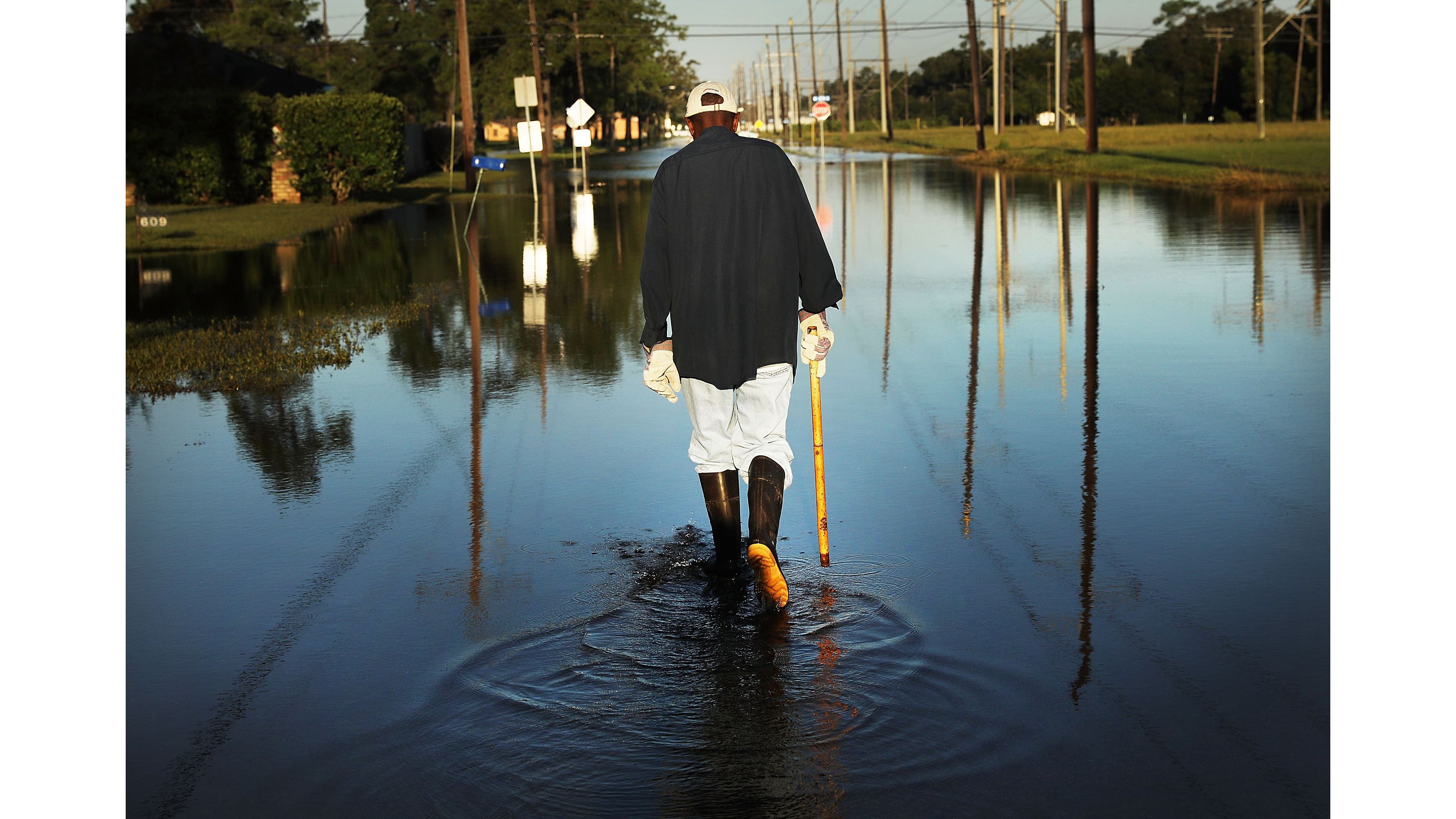 Paul Morris checks on neighbors homes as Texas slowly moves toward recovery from the devastation of Hurricane Harvey on September 7, 2017. 