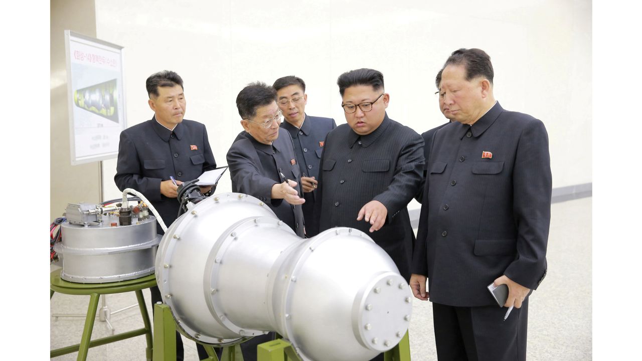 North Korean leader Kim Jong Un provides guidance with Ri Hong Sop (2nd L) and Hong Sung Mu (R) on a nuclear weapons program in this undated photo released by North Korea's Korean Central News Agency (KCNA) in Pyongyang September 3, 2017.