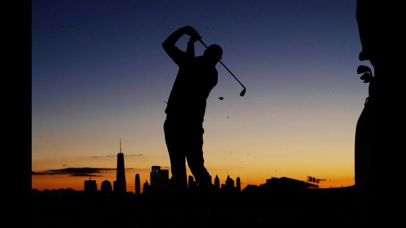 Marc Leishman practices on the driving range before the start of play during the four-ball golf matches on the third day of the Presidents Cup at Liberty National Golf Club in Jersey City, N.J., Saturday, Sept. 30, 2017. (AP Photo/Julio Cortez)