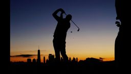 Marc Leishman practices on the driving range before the start of play during the four-ball golf matches on the third day of the Presidents Cup at Liberty National Golf Club in Jersey City, N.J., Saturday, Sept. 30, 2017. (AP Photo/Julio Cortez)