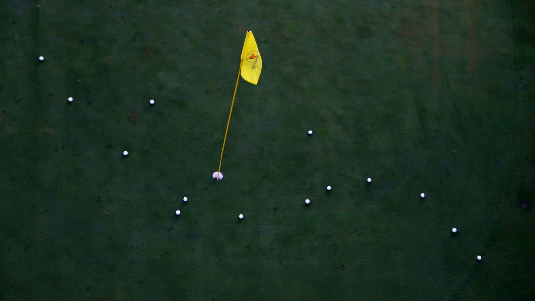 The practice green is used before the start of play on the third day of the Presidents Cup at Liberty National Golf Club in Jersey City, N.J., Saturday, Sept. 30, 2017. (AP Photo/Julio Cortez)