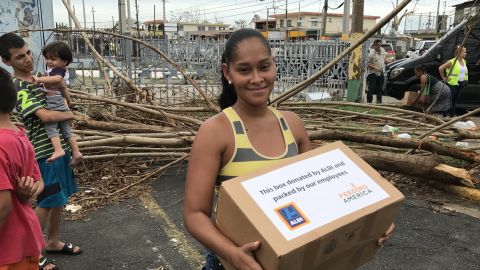 Casandra Rodriguez, 30, after she received food provided by pop star Daddy Yankee.