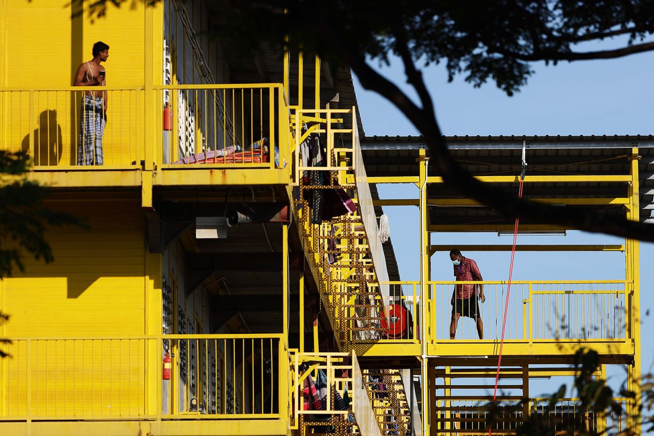 Migrant workers are seen outside their dormitory rooms in Singapore on April 21. 