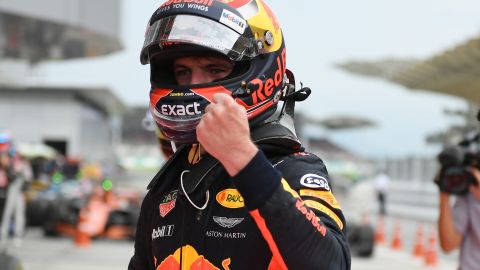 Red Bull's Dutch driver Max Verstappen celebrates winning the Malaysian Grand Prix, his second career F1 victory.