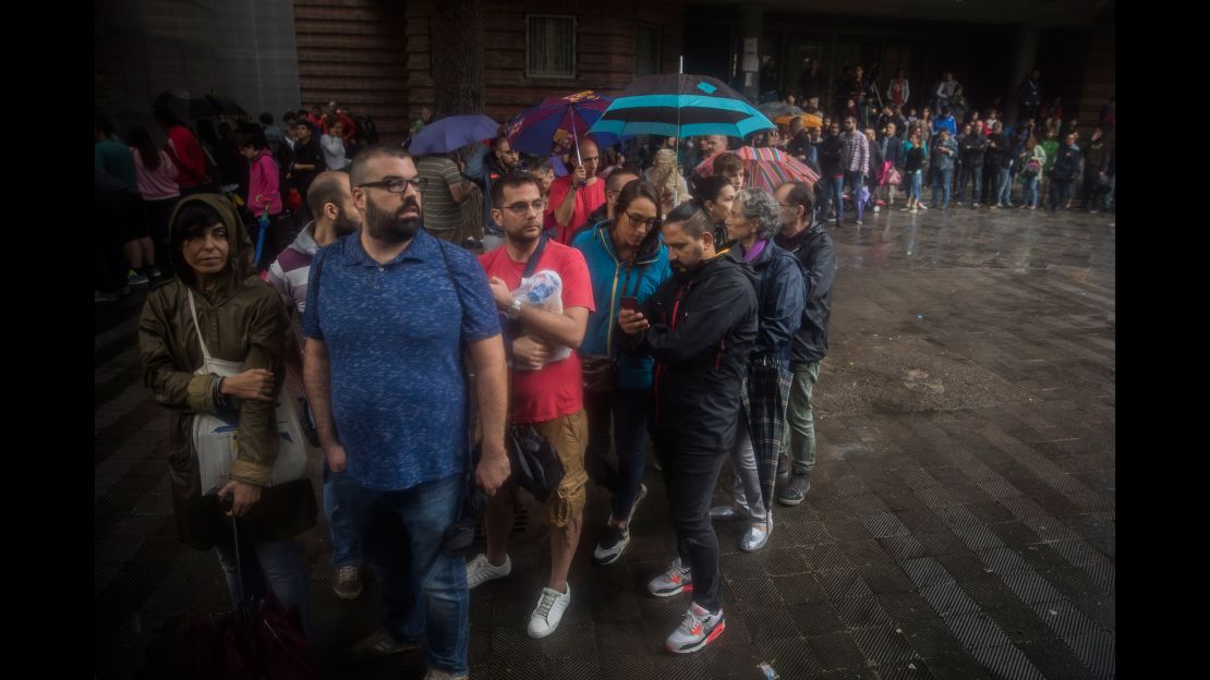 People queue to vote in the banned referendum on Catalonia's independence.