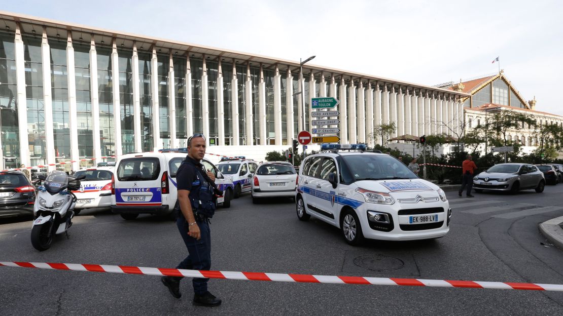 A French police officer cordons off Marseille's Saint-Charles train station on Sunday.