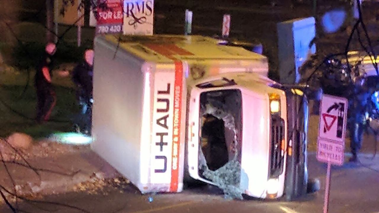 A rental truck lies on its side in Edmonton, Alberta, after a high-speed chase early Sunday.  