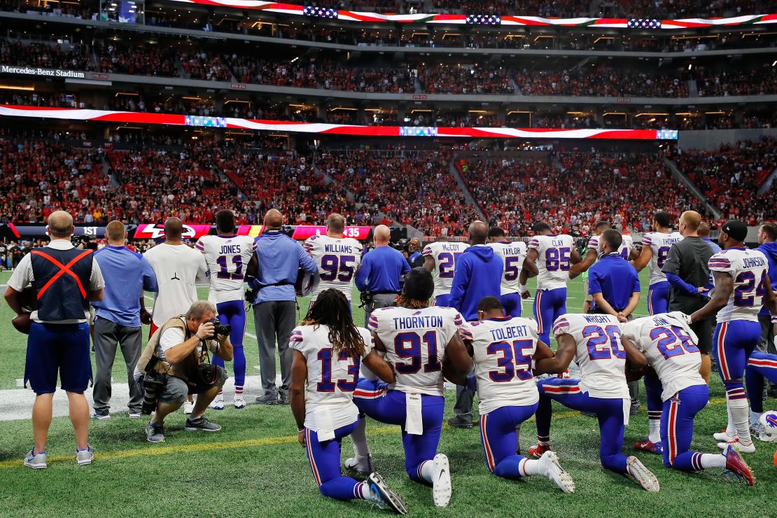 Buffalo Bills players kneel during the National Anthem before their match against Atlanta Falcons at Mercedes-Benz Stadium. 