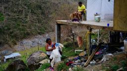 Yadira Sortre and William Fontan Quintero clean their house, destroyed by Hurricane Maria in in Moravis, Puerto Rico, Sunday, Oct. 1, 2017. "We lost everything." Fontan said. They have three children, one lives in Chicago and two live with them in Puerto Rico. 