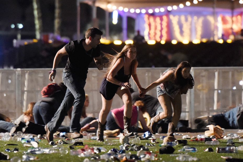 People run from the festival grounds.