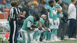 LONDON, ENGLAND - OCTOBER 01: Miami Dolphins players kneel down during the national anthem before the NFL game between the Miami Dolphins and the New Orleans Saints at Wembley Stadium on October 1, 2017 in London, England. (Photo by Henry Browne/Getty Images)