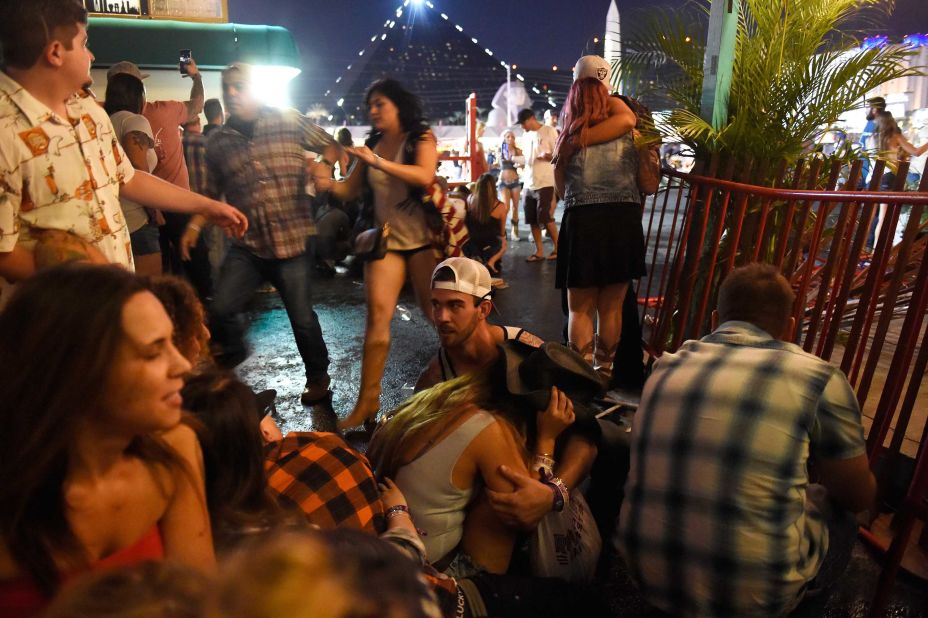 A crowd takes cover at the festival grounds.