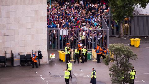 Spectators queued to access the Camp Nou stadium ahead of the match, which was ultimately played with empty stands after violence erupted at polling stations.
