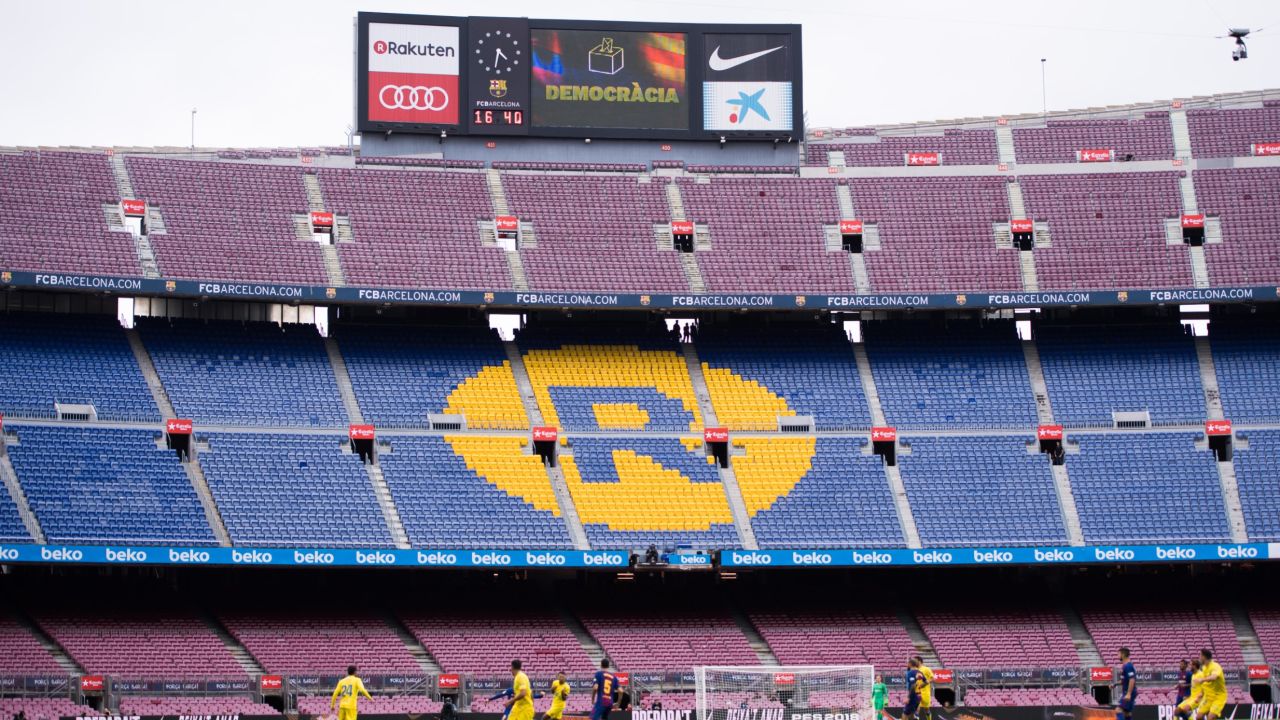 The word 'Democracia', Catalan for 'Democracy', is displayed in the Camp Nou stadium board during FC Barcelona's match.
