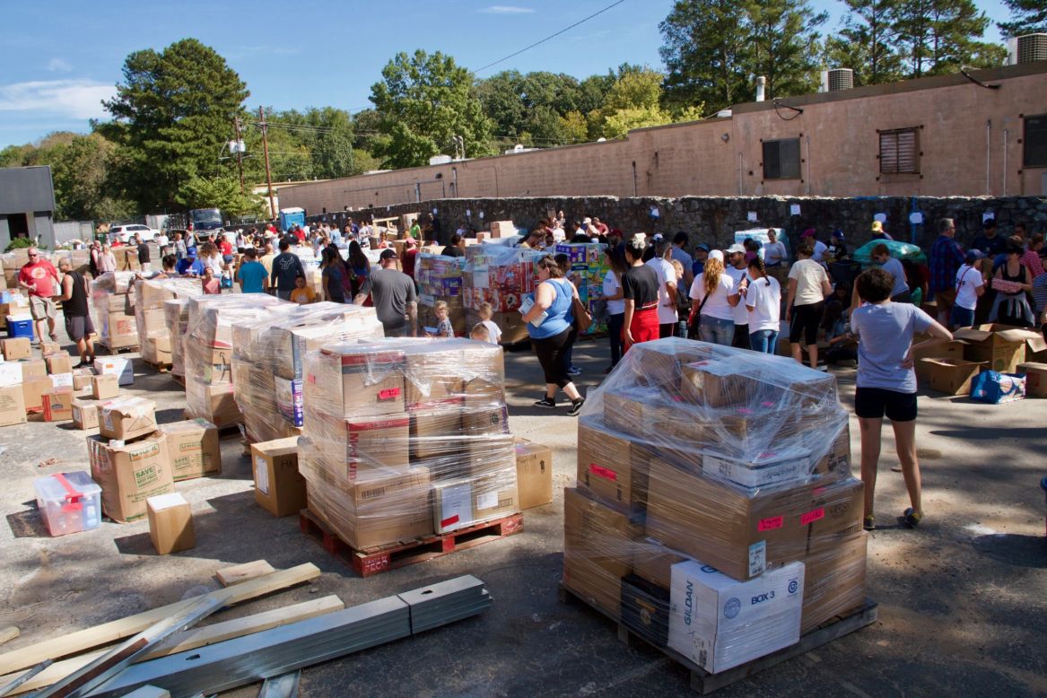 Volunteers for "Puerto Ricovery" sort and pack the donated supplies before they are loaded into containers for shipment to the island.