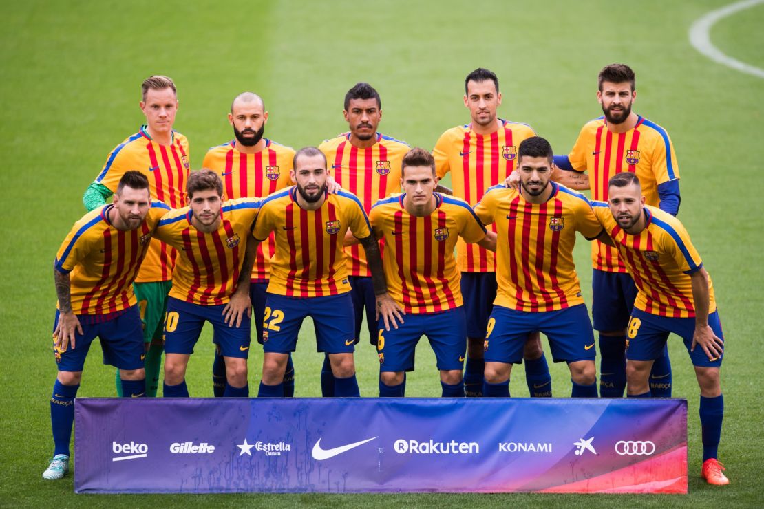 FC Barcelona pose for a team photo wearing shirts in the colors of the Catalan flag prior to kickoff. The team played the match in its traditional home jersey.