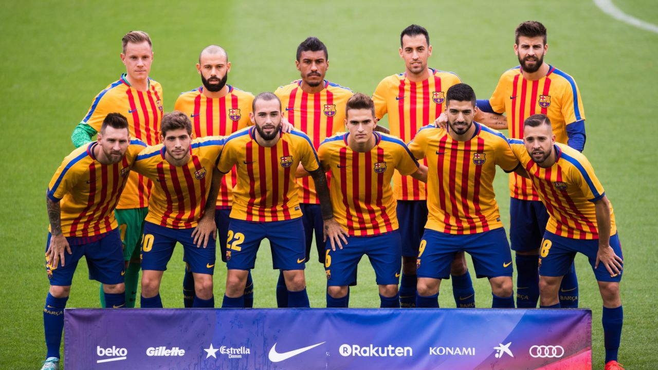 FC Barcelona pose for a team photo wearing shirts in the colors of the Catalan flag prior to kickoff. The team played the match in its traditional home jersey.