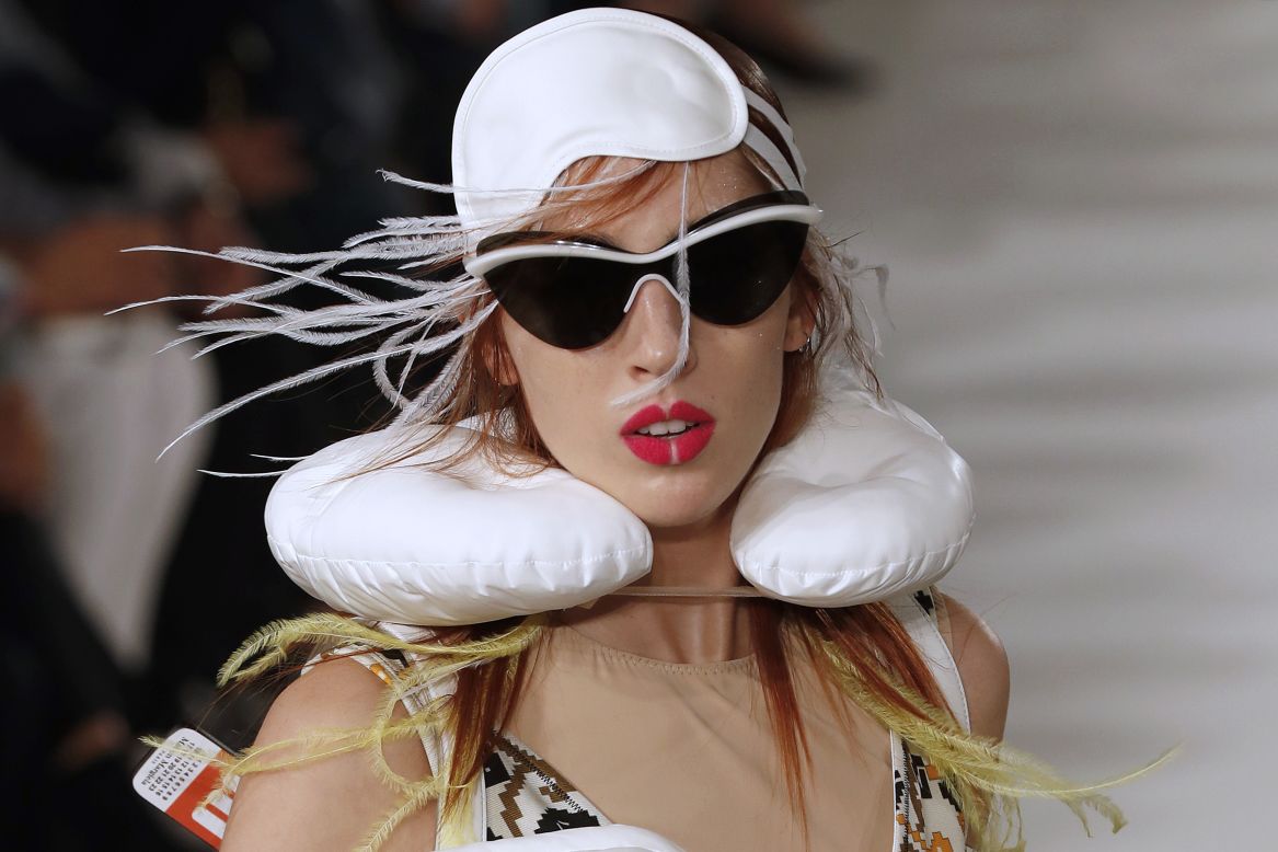John Galliano's latest collection for Maison Margiela, featuring neck pillows and luggage tags, had notes of airport chic.