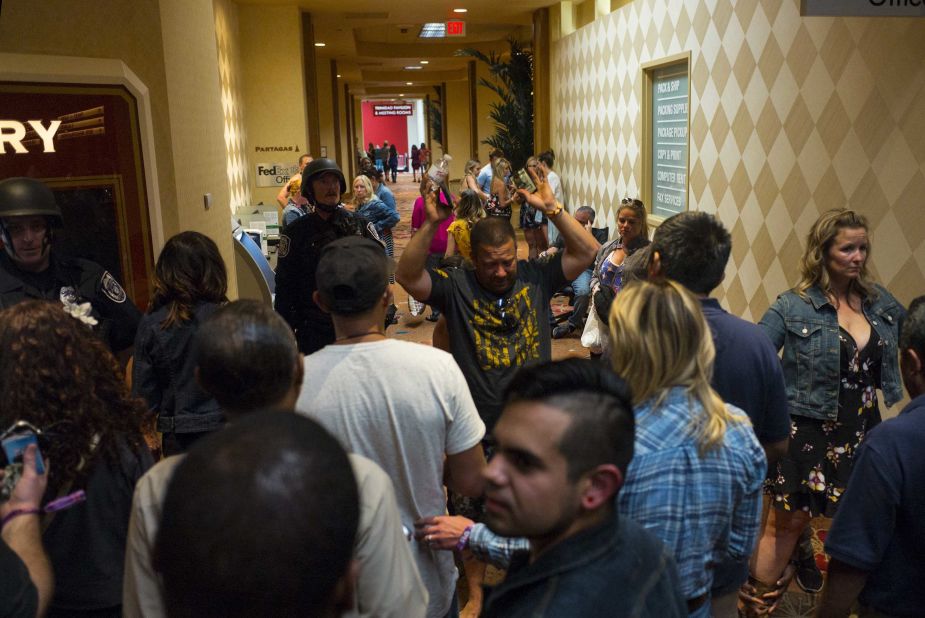 People are searched by police at the Tropicana.