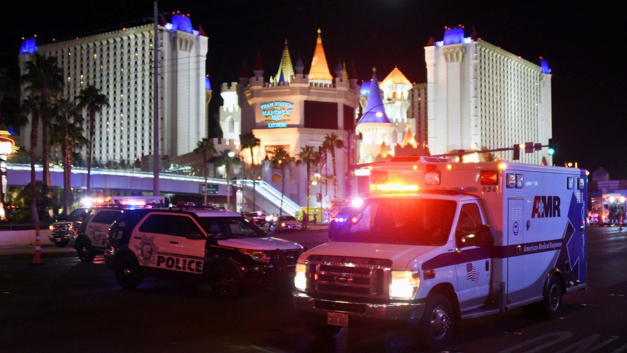 LAS VEGAS, NV - OCTOBER 02:  An ambulance leaves the intersection of Las Vegas Boulevard and Tropicana Ave. after a mass shooting at a country music festival nearby on October 2, 2017 in Las Vegas, Nevada. A gunman has opened fire on a music festival in Las Vegas, leaving at least 20 people dead and more than 100 injured. Police have confirmed that one suspect has been shot. The investigation is ongoing. (Photo by Ethan Miller/Getty Images)