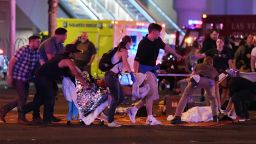 LAS VEGAS, NV - OCTOBER 02:  An injured person is tended to in the intersection of Tropicana Ave. and Las Vegas Boulevard after a mass shooting at a country music festival nearby on October 2, 2017 in Las Vegas, Nevada. A gunman has opened fire on a music festival in Las Vegas, killing over 20 people. Police have confirmed that one suspect has been shot dead. The investigation is ongoing. (Photo by Ethan Miller/Getty Images)