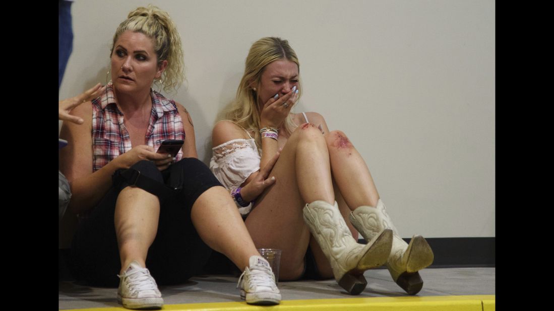 A woman cries while hiding inside the Sands Corporation plane hangar.