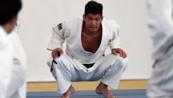 Japanese national judo team head coach Kosei Inoue (C) looks at his athletes during the open training session in Rio de Janeiro on August 1, 2016 ahead of Rio 2016 Olympic Games. / AFP / TOSHIFUMI KITAMURA        (Photo credit should read TOSHIFUMI KITAMURA/AFP/Getty Images)