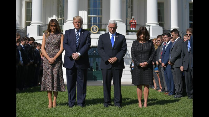 From left, first lady Melania Trump, US President Donald Trump, Vice President Mike Pence and Pence's wife, Karen, take part in a moment of silence at the White House on October 2.
