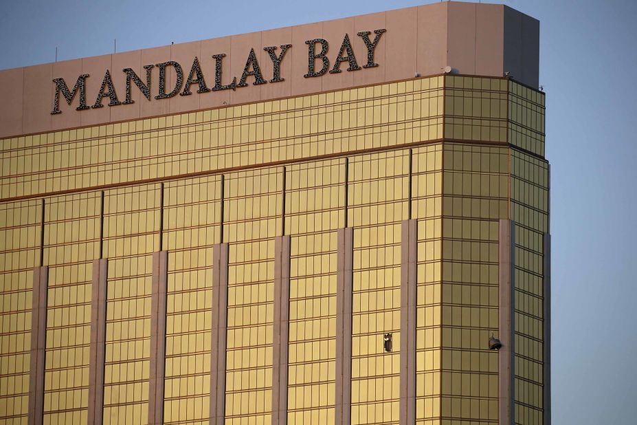 Broken windows of the Mandalay Bay are seen early in Las Vegas on Monday. Police said the gunman fired on the crowd from the 32nd floor of the hotel.