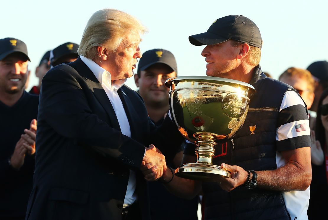 U.S. President Donald Trump presents Captain Steve Stricker and the U.S. Team with the trophy