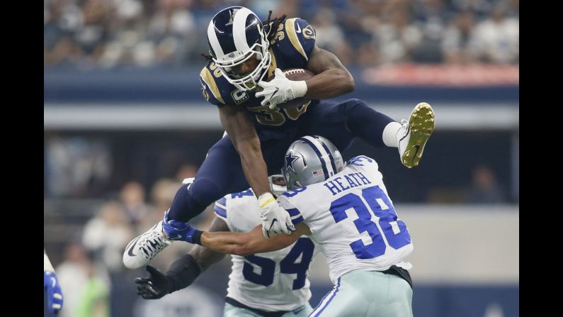 Los Angeles Rams running back Todd Gurley hurdles Dallas safety Jeff Heath during an NFL game in Arlington, Texas, on Sunday, October 1. Gurley had more than 200 yards of offense as the Rams won 35-30.