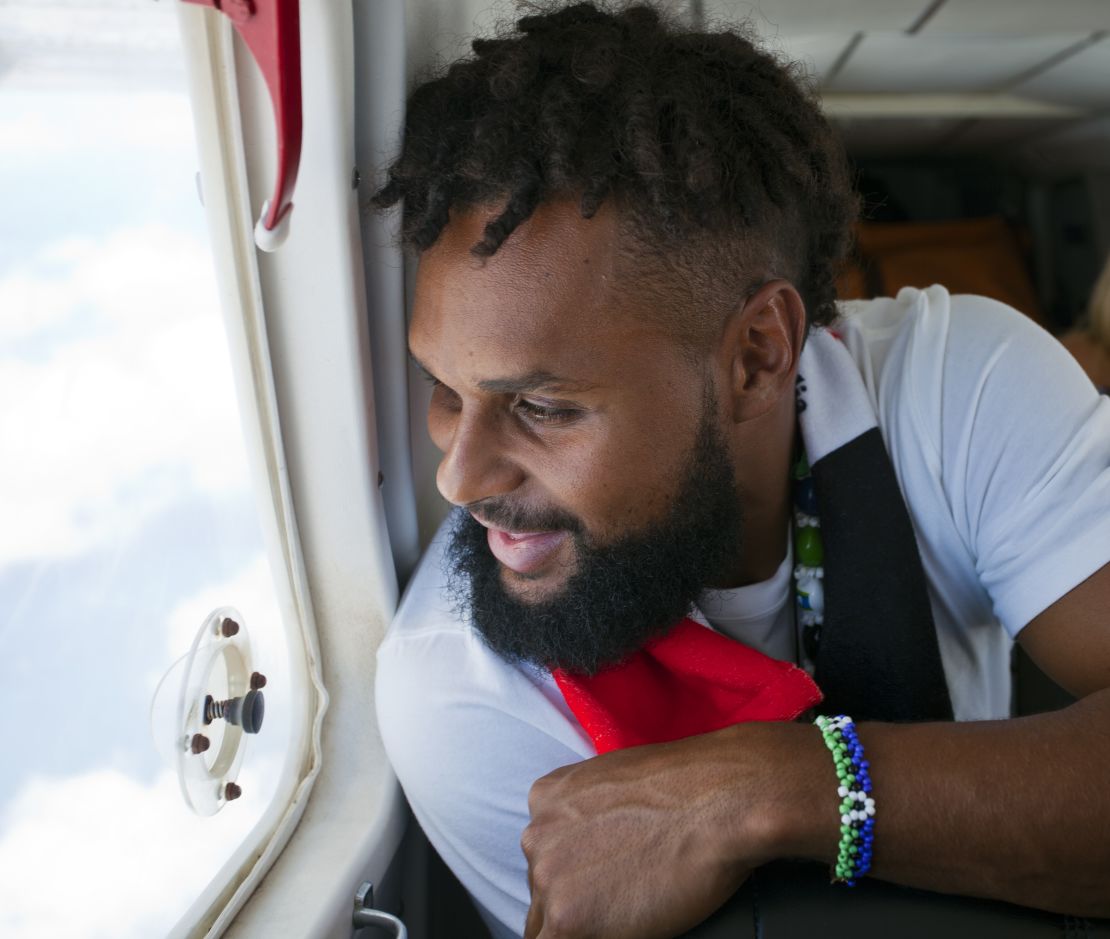 Australian NBA star Patty Mills looks out of the plane as he heads to his ancestral home of Mer off the northern coast of Australia.