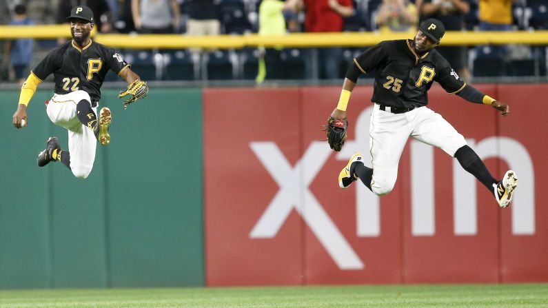 Pittsburgh outfielders Andrew McCutchen, left, and Gregory Polanco leap in celebration after a home win over Baltimore on Wednesday, September 27.